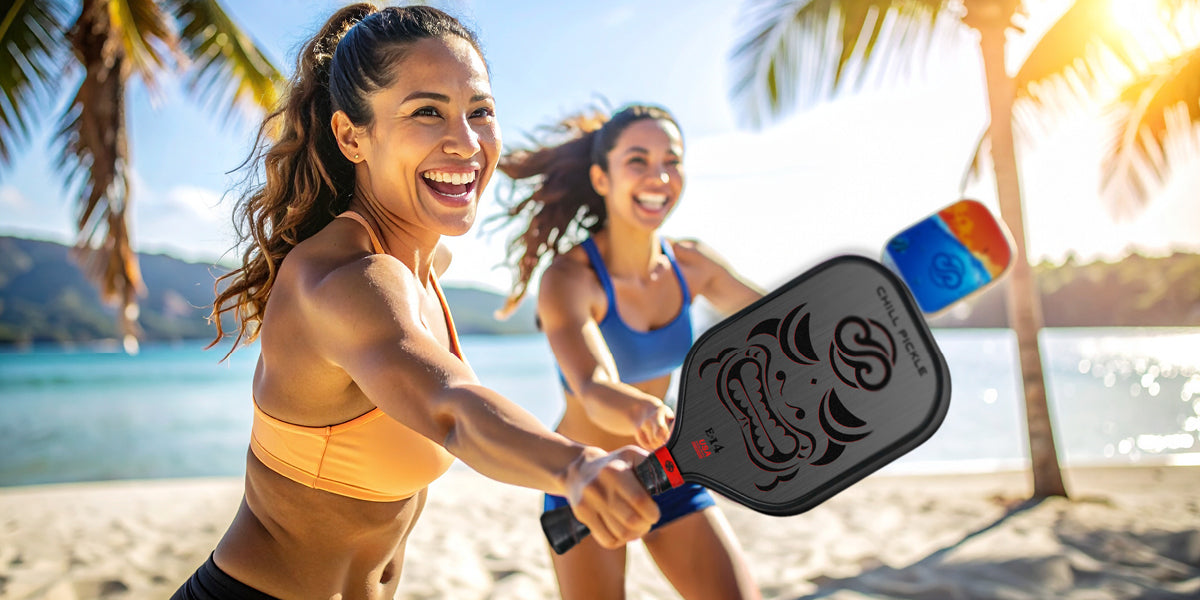 Chill Pickle pickleball players enjoying a beachside game with Kahuna and Makai paddles under tropical sunshine